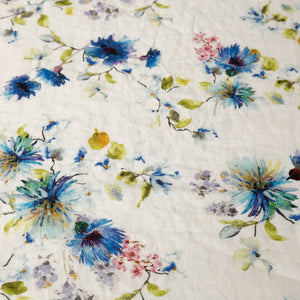Flowers on White Linen Tablecloth